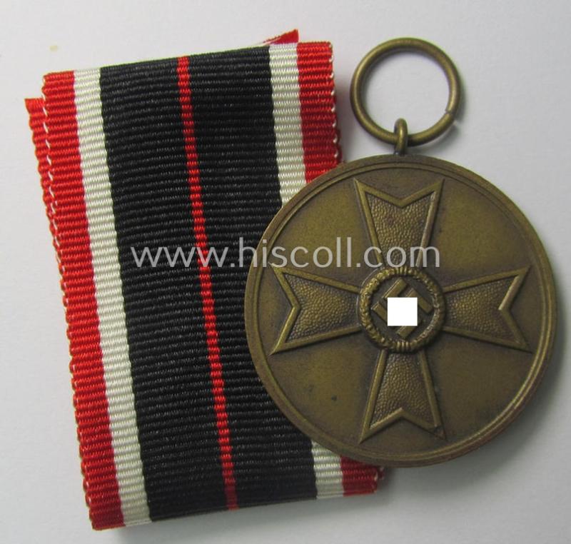 Neat, 'Kriegsverdienstmedaille 1939' being a non-maker-marked- (and/or: typical 'Buntmetall'-based) specimen that came together with its full-length (and bright-red-coloured!) ribbon (ie. 'Bandabschnitt')