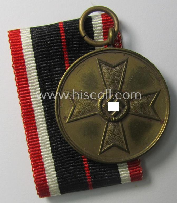 Neat, 'Kriegsverdienstmedaille 1939' being a non-maker-marked- (and/or: typical 'Buntmetall'-based) specimen that came together with its full-length (and bright-red-coloured!) ribbon (ie. 'Bandabschnitt')