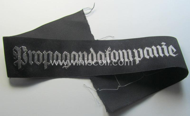 Superb - and most certainly rarely seen! - WH (Heeres) related cuff-title (ie. 'Ärmelstreifen') being a typical black-coloured- and linnen-based example showing the (neatly silver-toned- and 'flatwire'-woven!) text that reads: 'Propagandakompanie'