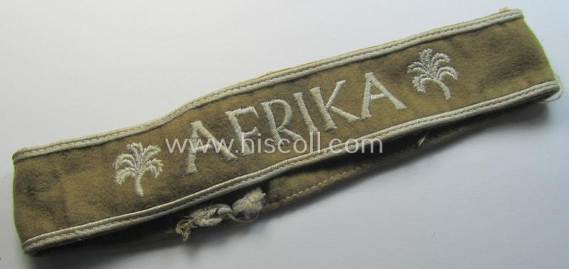 Attractive - and clearly worn! - WH cuff-title (ie. 'Ärmelstreifen') entitled: 'Afrika' (being a minimally shortened example that comes in an overall very nice- (ie. issued and clearly worn ie. once tunic-attached-), condition)