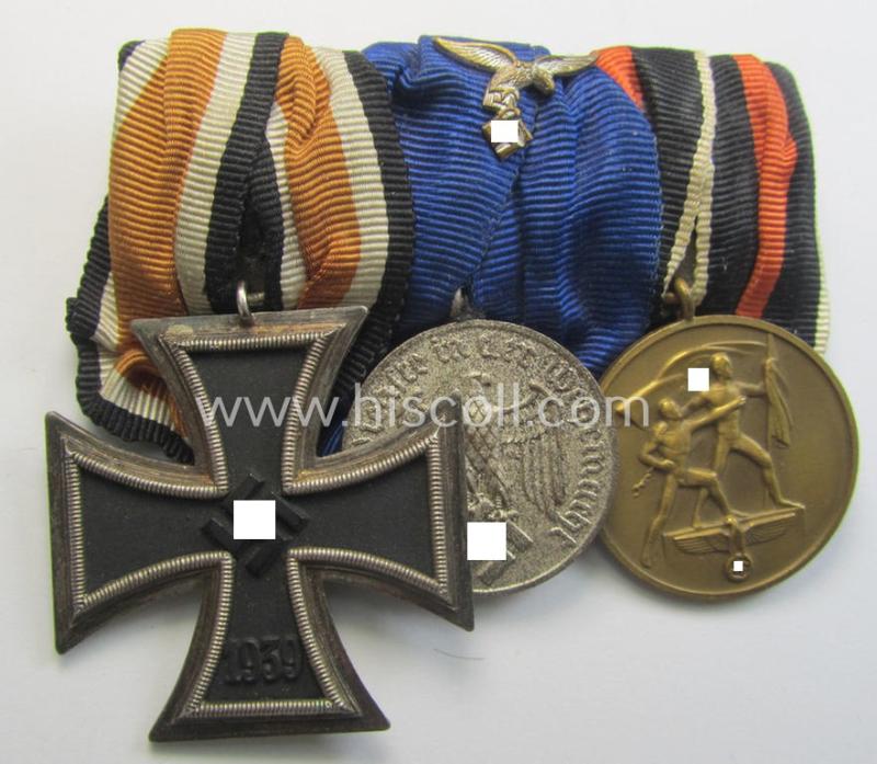 Superb example of a 3-pieced WH (Luftwaffe) medal-bar (ie.: 'Ordenspange') resp. showing an: 'EKII. Kl.', a: 'WH-DA der 4. Stufe' (with down-tailed eagle-device) and a: Czech 'Anschluss'-medal