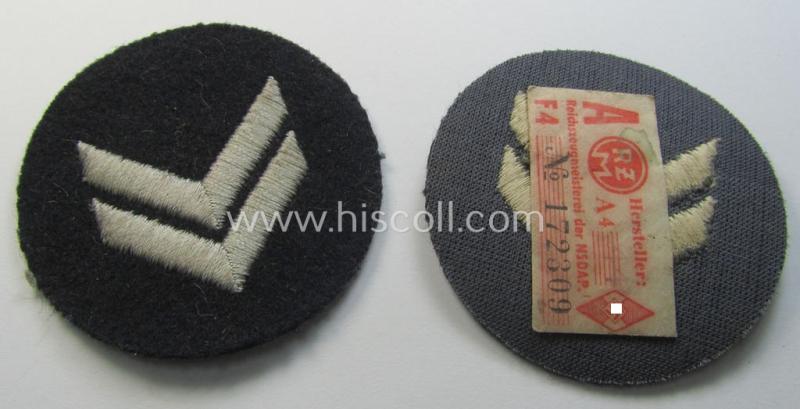 Neat - and simply never used! - DJ- (ie. 'Deutsches Jungvolk in der HJ') darker-blue-toned rank-patch ('Rangzeichen') depicting two silver-greyish-toned rank-chevrons as was specifically intended for usage by a: 'DJ-Oberhordenführer'