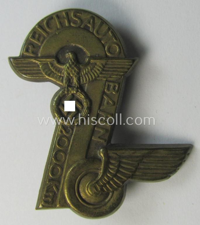 Commemorative, golden-bronze-coloured and N.S.D.A.P.-related 'tinnie' being a non-maker-marked example depicting a detailed eagle-device and 'winged-wheel' surrounded by the text: 'Reichsautobahn - 20000 Km'