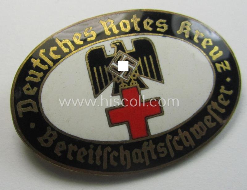 Stunning - and rarely seen! - DRK (ie. 'Deutsches Rotes Kreuz') nurses'-badge entitled: 'Bereitschaftsschwester' being an oval-shaped- and/or maker-marked specimen showing an engraved bearers'-number: ('13') and towns'-name: 'Karlsruhe'