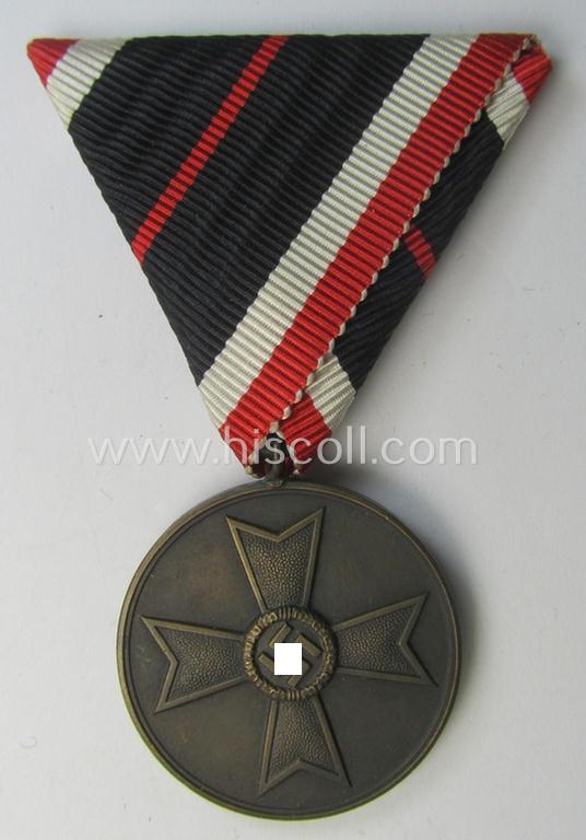 Interesting medal-set: 'Kriegsverdienst-Medaille 1939' being a (typical) non-maker-marked- (and/or: 'Buntmetall'-based) specimen that came mounted onto its (scarcely seen!) bright-red-coloured- and/or Austrian-styled ribbon (ie. 'Bandabschnitt')