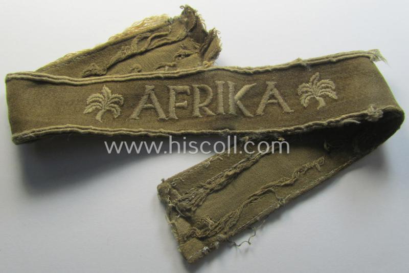 Attractive - and clearly worn- ie. relic! - WH cuff-title (ie. 'Ärmelstreifen') entitled: 'Afrika' (being a almost non-shortened example that comes in an overall very nice- (ie. issued and clearly worn ie. once tunic-attached-), condition)