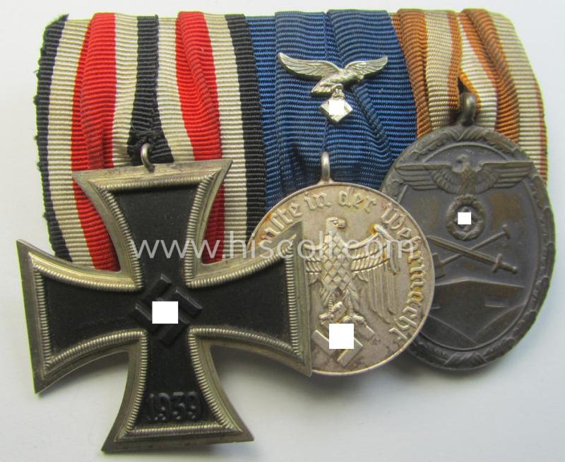 Attractive example of a 3-pieced WH (Luftwaffe) medal-bar (ie.: 'Ordenspange') resp. showing an: 'EKII. Kl.', a: 'WH-DA der 4. St.' (with attached eagle-device) and a: 'Deutsches Schutzwall Ehrenzeichen' (aka: 'Westwall'-medal)