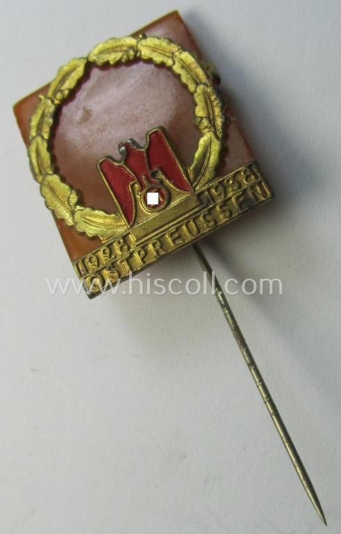 Attractive - and scarcely encountered! - commemorative lapel-pin (ie. 'Veranstaltungsabzeichen') as executed in golden-toned 'Buntmetall' and genuine 'Barnstein' and depicting the text: '1928-1938 - Ostpreussen'