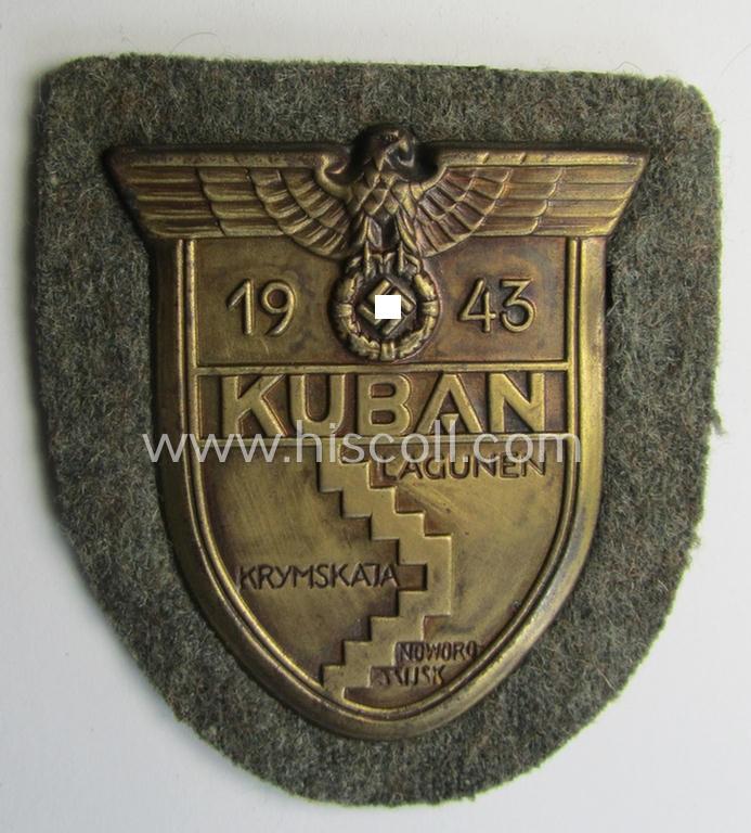 Attractive - truly worn and actually scarcely encountered! - WH (Heeres ie. Waffen-SS) 'Kuban'-campaign-shield that comes mounted onto its original field-grey-coloured- and/or woolen-based 'backing' as issued and/or used