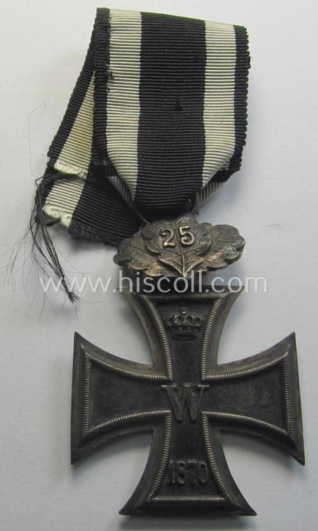 Superb, 1870-period: 'Eisernes Kreuz II. Klasse' (or: iron cross second class) showing a (firmly & period!) 'Eichenlaubspange 25' attached and that comes mounted onto its (minimally) confectioned piece of ribbon (ie. 'Bandabschnitt')