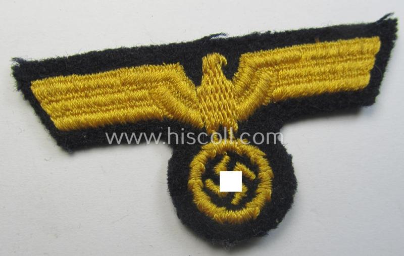 Attractive, WH (KM) EM ie. NCO-type, machine-embroidered visor-cap-eagle as executed in yellow-coloured linnen as intended for usage on the various naval, EM- ie. NCO-pattern visor-caps