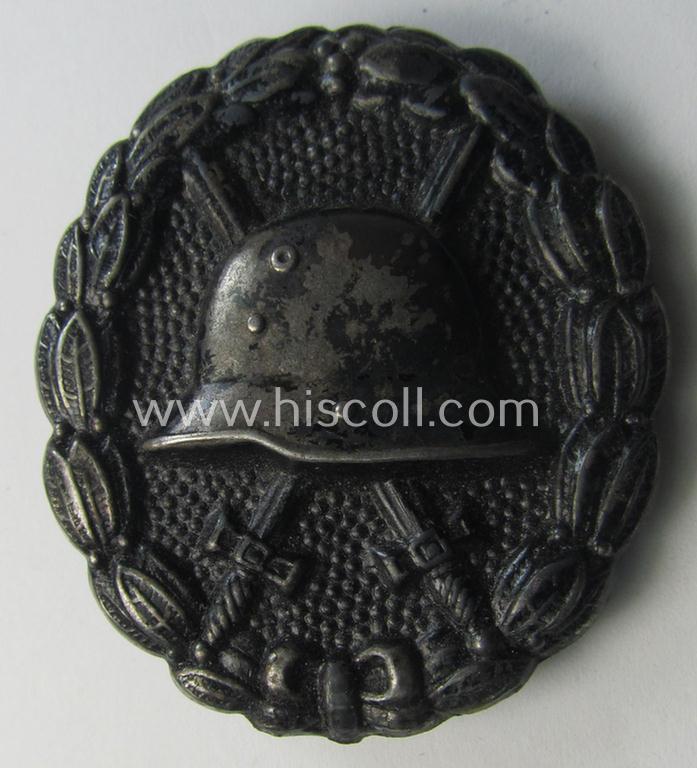 WWI-pattern, steel-based black-class wound-badge (ie.: 'Verwundeten Abzeichen in Schwarz') being a detailed (and typical magnetic) example that comes in a clearly used- ie. most certainly worn, condition