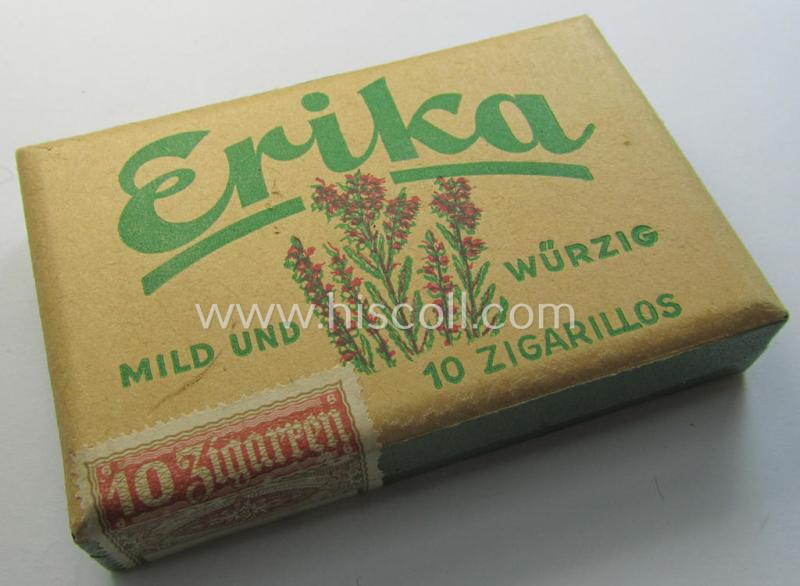 WH-era, unissued (ie. full!) cigarillos-package of the make: 'Erika - Mild und Würzig' having a fully preserved: 'Banderolle' attached showing the 'Reichsadler'-device with swastika and that comes in a 'virtually mint, unissued', condition