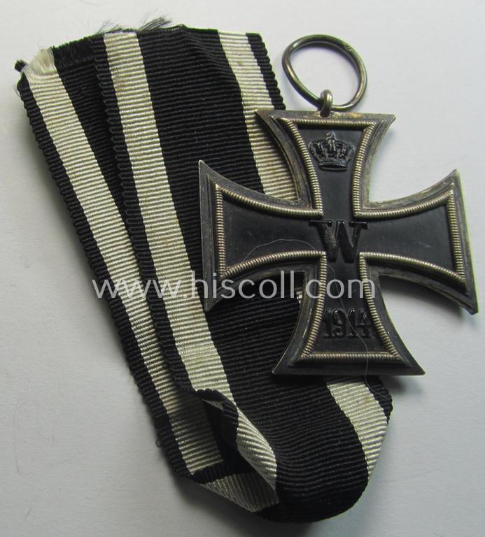 Attractive, WWI-period: 'Eisernes Kreuz II. Klasse' (or: iron cross second class) being a maker- (ie. 'W') marked example that comes together with its (minimally) confectioned piece of ribbon (ie. 'Bandabschnitt')