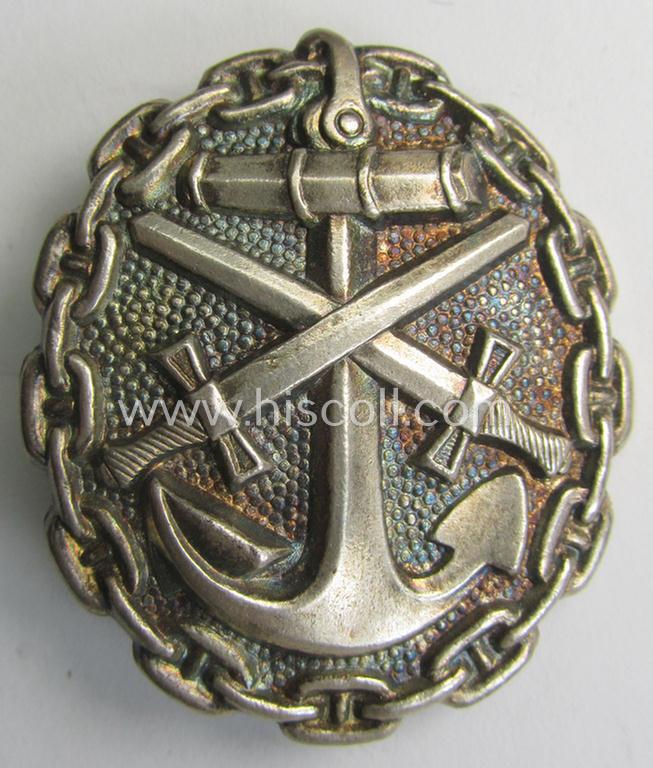 Attractive, WWI-pattern, silver-class (ie. 'Eisenblech versilbertes') naval wound-badge (ie.: 'Verwundetenabzeichen der Marine 1918 in Silber') being a detailed (and typical magnetic) example that comes in a moderately used condition