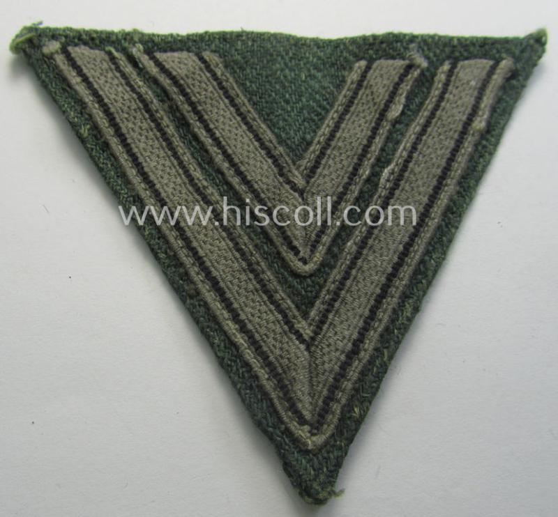 Attractive, WH (Heeres ie. Waffen-SS) 'Armwinkel' (or: arm-chevron) as was executed on a greenish-coloured- and/or 'HBT'-like (ie. 'Drillich'-) based background as was specifically intended for an: 'Obergefreiter' (ie. 'SS-Rottenführer')