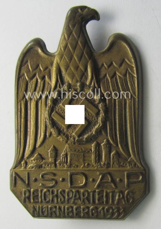 Attractive, N.S.D.A.P.-related 'tinnie' (ie. 'Tagungs- o. Veranstaltungsabzeichen'-) being a non-maker-marked, 'hollow-back'-pattern and golden-bronze-toned example showing the text: 'N.S.D.A.P. Reichsparteitag - Nürnberg 1933'