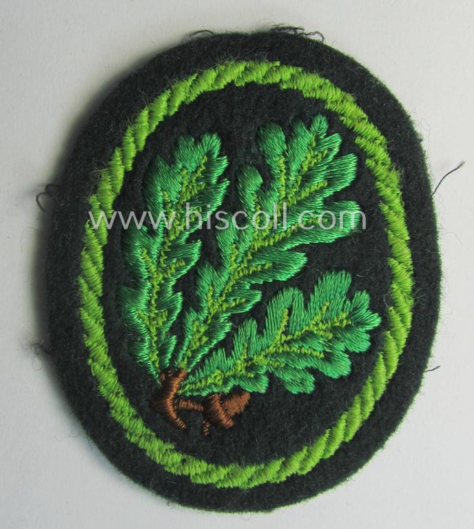 Attractive example of a WH (Heeres) so-called: 'Jäger'-armbadge being a neatly machine-embroidered- and/or multi-coloured version as was executed on darker-green-coloured wool