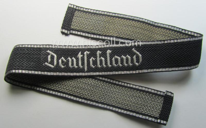 Stunning, Waffen-SS officers-type, 1939/40-pattern cuff-title (ie. 'Ärmelstreifen') as executed in flat-wire 'BeVo'-weave-pattern (in Gothic-styled script!) for an officer who served within the: SS-Rgt. 'Deutschland' (2. SS-Pz-Div. 