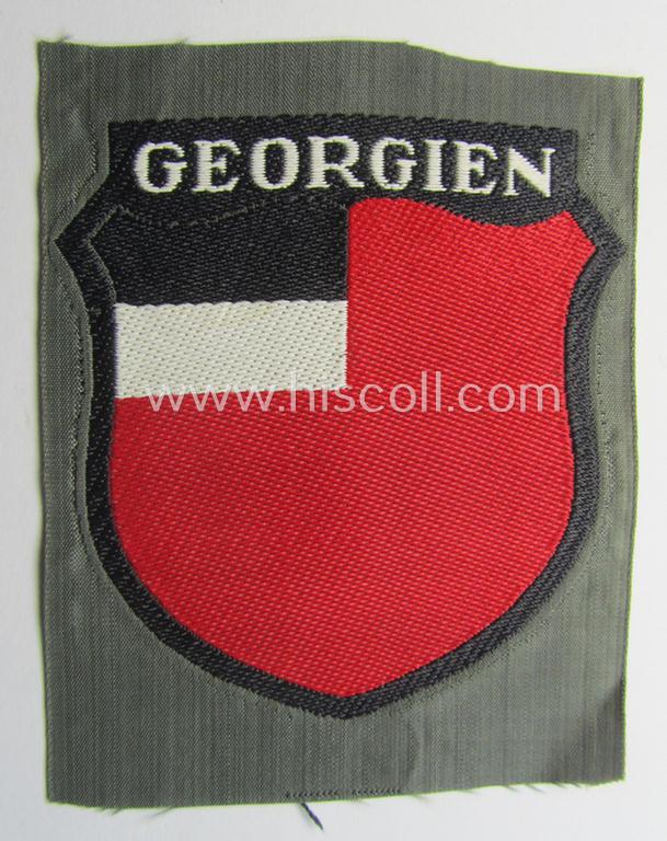 Attractive, 'BeVo'-type armshield entitled: 'Georgien' (being a 'virtually mint- ie. unissued' example as intended for a volunteer who served within the 'Deutsche Wehrmacht' ie. within the 'Georgisches Legion')