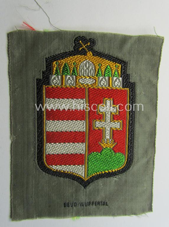 Attractive - and scarcely encountered! - German-produced, 'BeVo'-type armshield showing the coat of arms of Hungary (being a piece that was intended for a volunteer who served within the: 'Deutsche Wehrmacht')