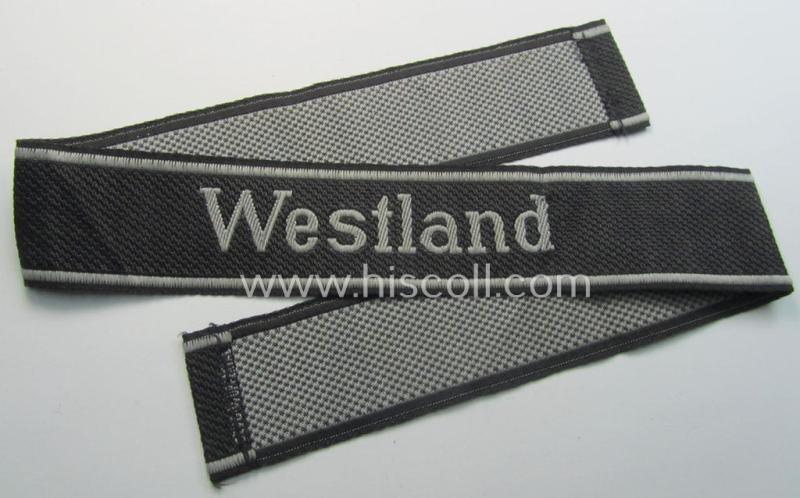 Superb, Waffen-SS, 1943/44 pattern cuff-title (ie. 'Ärmelstreifen') depicting the machine-woven Latin script text in silver-grey linnen as was intended for a member of the: 'SS-Regiment 