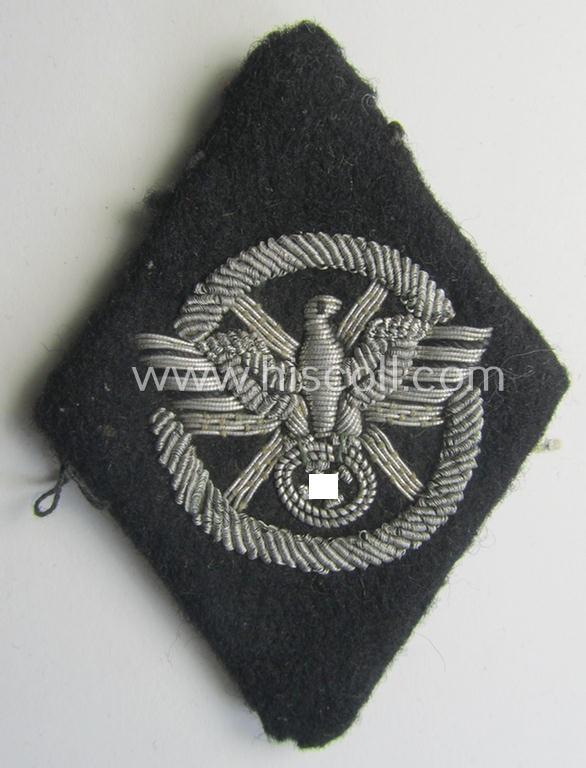 Stunning, N.S.K.K. (ie. 'National Socialistisches Kraftfahr Korps') officers'-pattern, hand-embroidered 'Kraftfahrraute des 2. Model' being an example of the 'Extra-Qualität' showing extraordinary detail and that shows its attached 'RzM'-etiket