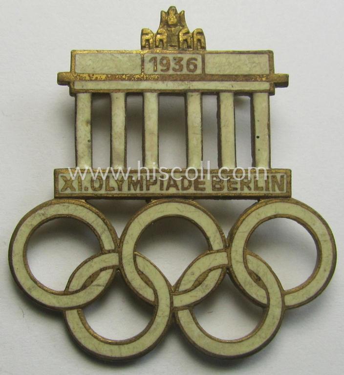 Commemorative - and neatly enamelled! - 'Veranstaltungsabzeichen' being a maker- (ie. 'W.D.'-) marked example that is showing the Olympic rings above an illustration of the: 'Reichstag' coupled with text: 'XI. Olympiade Berlin 1936'