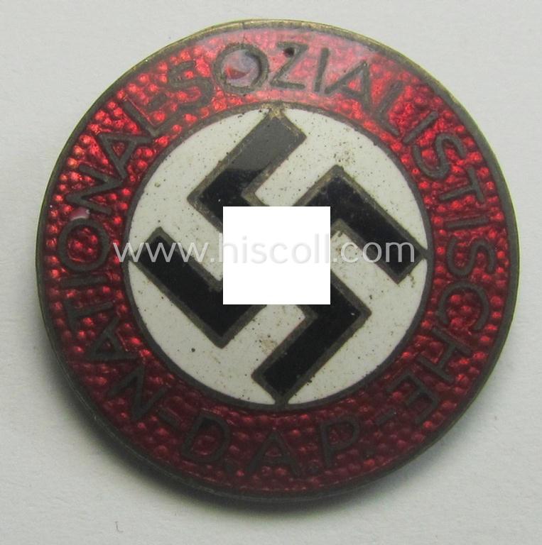 Attractive - bright-red-coloured and nicely preserved! - 'N.S.D.A.P.'-membership-pin- ie. party-badge (or: 'Parteiabzeichen') which is maker-marked on its back with the makers'-designation: 'RzM' and/or: 'M1/34'