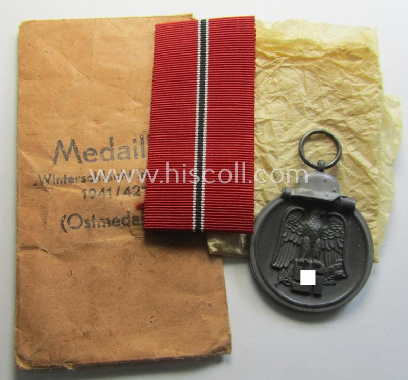 Superb medal-set: 'Winterschlacht im Osten 1941/42' as produced by the: 'Wilhelm Deumer'-company being a maker- (ie. '3'-) marked specimen that came stored in its original 'Zellstoff'-based pouch of issue as found