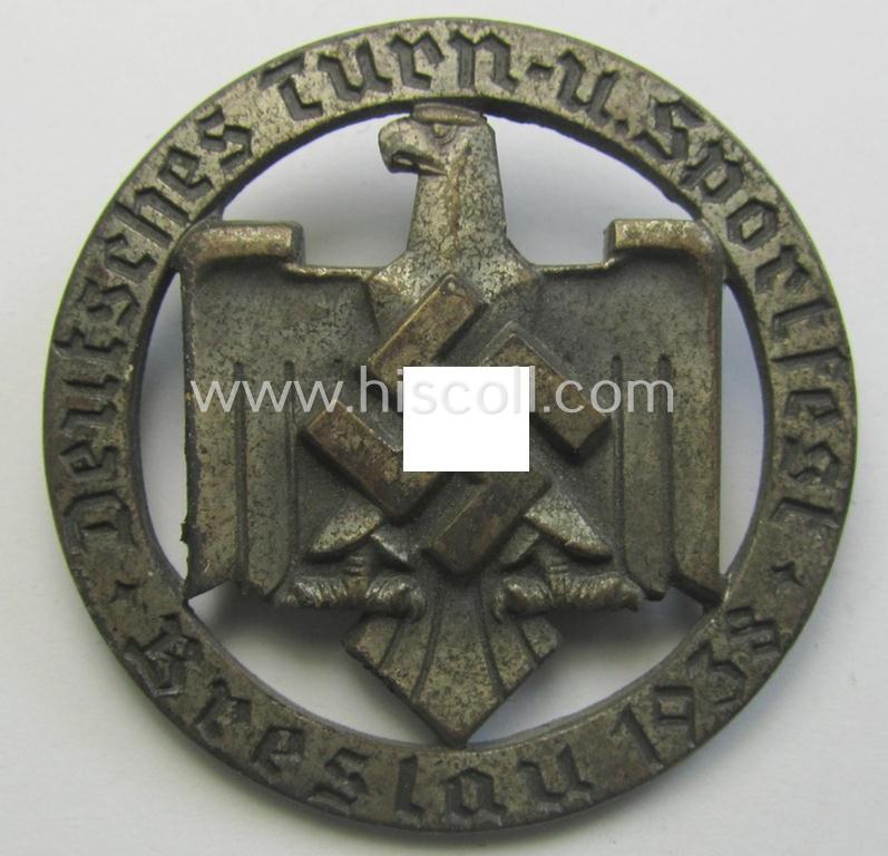 Silver-toned- and/or: 'Cupal'-based so-called: DRL- (ie. 'Deutschen Reichsbund für Leibesübungen'-) related day-badge (ie. 'tinnie' or: 'Veranstaltungsabzeichen') as issued to commemorate the: 'Deutsches Turn- u. Sportfest - Breslau - 1938'