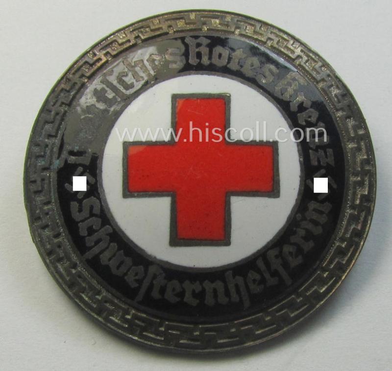 Attractive - and nicely preserved! - 'Buntmetall'-based, DRK (ie. 'Deutsches Rotes Kreuz' or German Red Cross) nurses'-helpers-badge entitled: 'Schwesternhelferin' (being an example that shows a: 'Ges.Gesch.'- patent-pending-designation