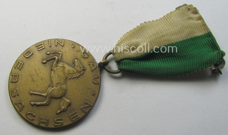 Superb - and most certainly unusually seen! - bright-golden-toned, TR-period shooting-medal that is entitled: 'Opferschiessen 1935 - Dtsch. Schützenbd. Krs. Lüneburg/Uelzen' that comes mounted onto its nicely preserved ribbon as issued