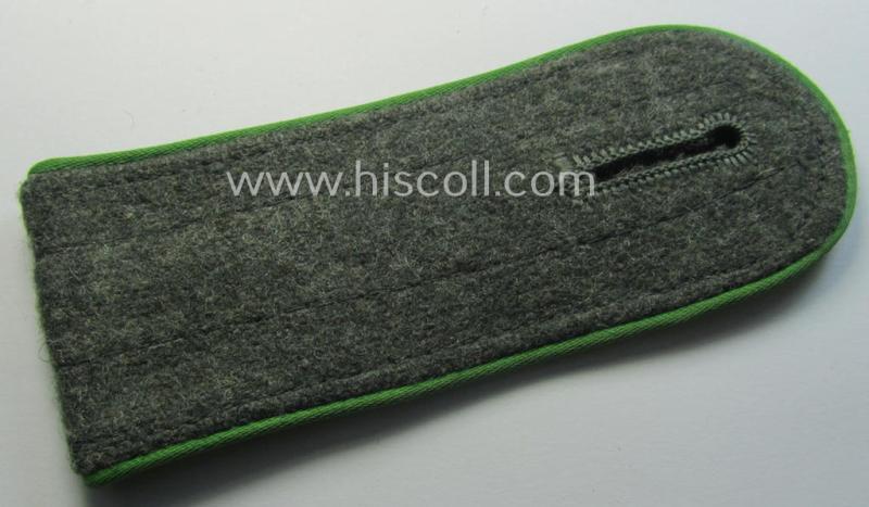 Single, later-war-period, so-called: 'M44'-pattern, 'simplified' WH (Heeres) enlisted-mens'-type shoulderstrap as piped in the bright-green- (ie. 'hellgrüner'-) coloured branchcolour as was intended for by a: 'Soldat der Panzer-Gren.-Truppen'