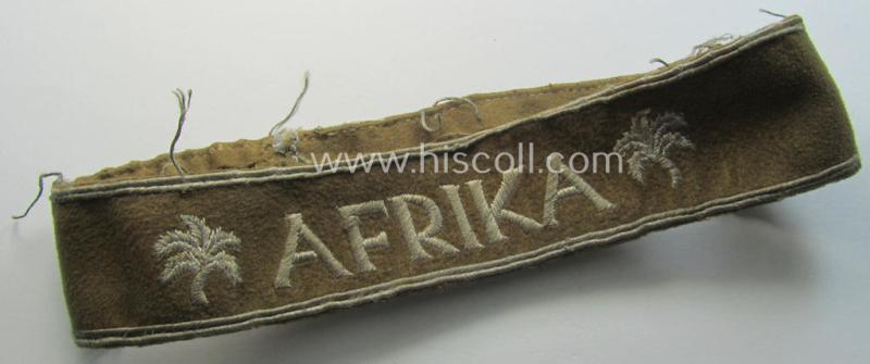 Attractive - and clearly worn! - WH cuff-title (ie. 'Ärmelstreifen') entitled: 'Afrika' (being a minimally shortened example that comes in an overall very nice- (ie. issued and clearly worn ie. once tunic-attached-), condition)