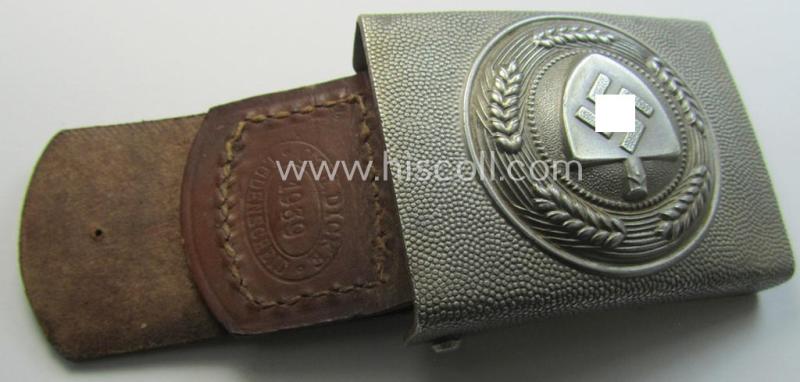 Neat, silverish-grey-toned, so-called: 'Reichsarbeitsdienst'- (ie. RAD-) enlisted-mens'- (ie. NCO-) type belt-buckle being a maker- (ie. 'C.T.D.'-) marked example which is dated: '1939' and that comes mounted onto its leather-based tab