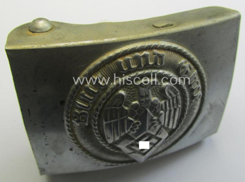 Attractive, HJ (ie. 'Hitlerjugend') silver-coloured- (ie. typically steel-based and 'crank-catch-variant'-pattern) belt-buckle being a neatly maker- (ie. 'RzM M4/42'-) marked example that comes in a just moderately used- ie. worn condition, as found