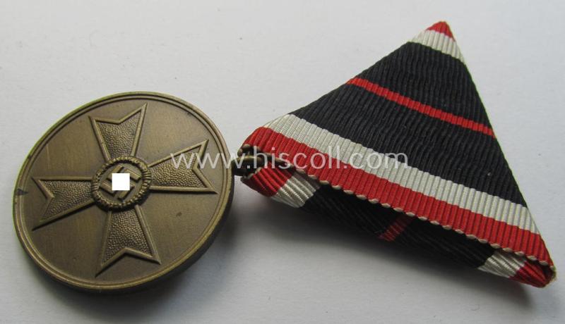 Interesting medal-set: 'Kriegsverdienstmedaille 1939' being a non-maker-marked- (and/or: typical 'Buntmetall'-based) specimen that came mounted onto its (scarcely seen!) Austrian-styled and trapezoid-folded ribbon (ie. 'Bandabschnitt')