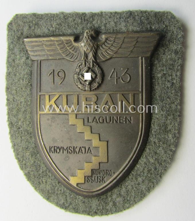 Stunning - and actually scarcely encountered! - WH (Heeres ie. Waffen-SS) 'Kuban'-campaign-shield that comes mounted onto its original field-grey-coloured- and/or woolen-based 'backing'