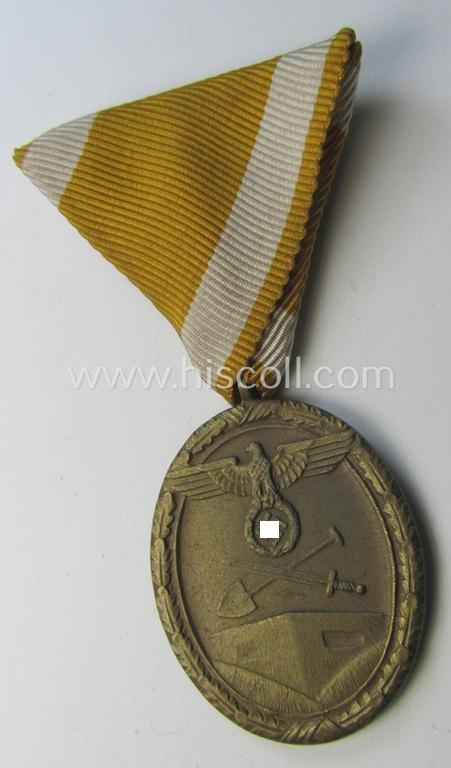 Interesting medal-set: 'Deutsches Schutzwall Ehrenzeichen' (aka: 'Westwall'-medal) being a non-maker-marked- (and/or: typical 'Buntmetall'-based) specimen that came mounted onto its (scarcely seen!) Austrian-styled and trapezoid-folded ribbon