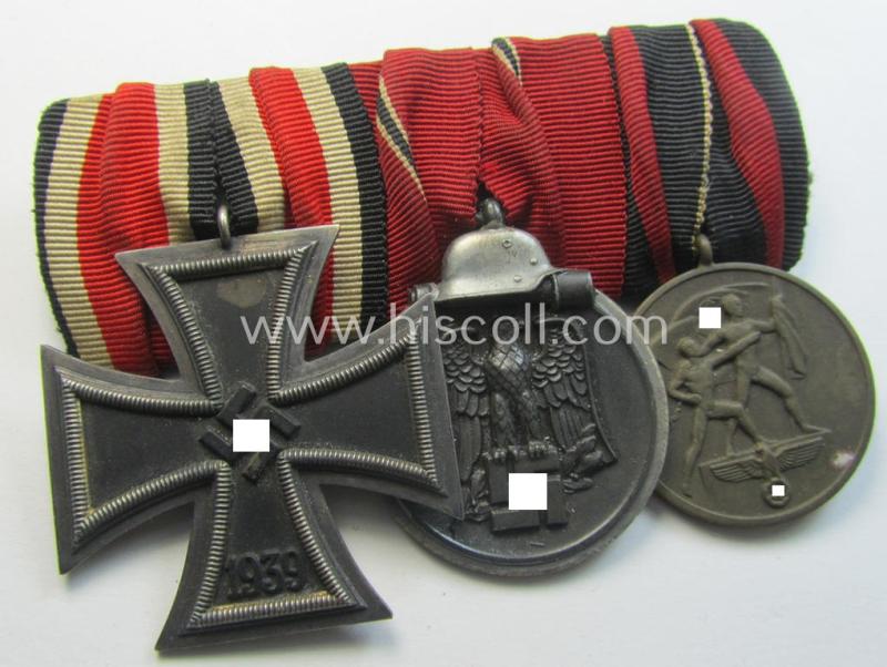 Attractive example of a 3-pieced WH (Heeres etc.) medal-bar (ie.: 'Ordenspange') resp. showing an: 'EKII. Kl.', an: 'Ost'-medal and a: Czech 'Anschluss'-medal