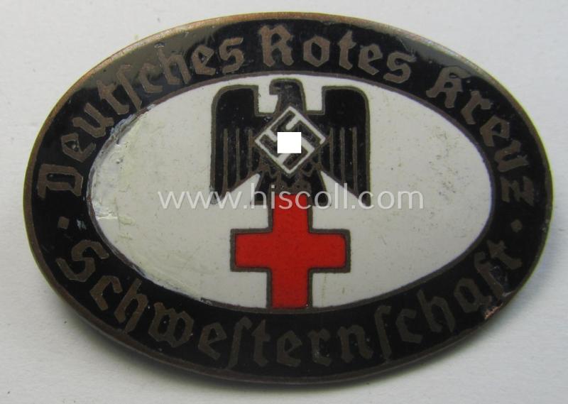 Attractive - and rarely seen! - DRK (ie. 'Deutsches Rotes Kreuz') so-called: nurses'-badge entitled: 'Schwesternschaft' being an oval-shaped- and/or maker-marked specimen showing an engraved bearers'-number: ('24') and towns'-name: 'Karlsruhe'