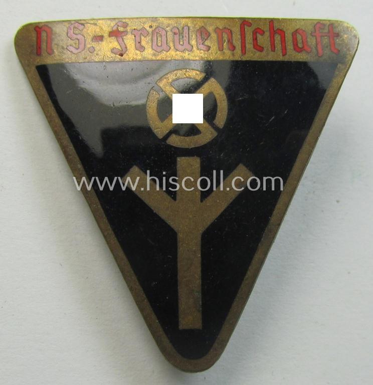 Very detailed and neatly enamelled 'NS-Frauenschaft'-membership-badge (ie. 'Mitgliedsabzeichen') being a (typical) 3-cms.-sized example of the eight pattern that shows an: 'RzM M1/137'-designation on its back