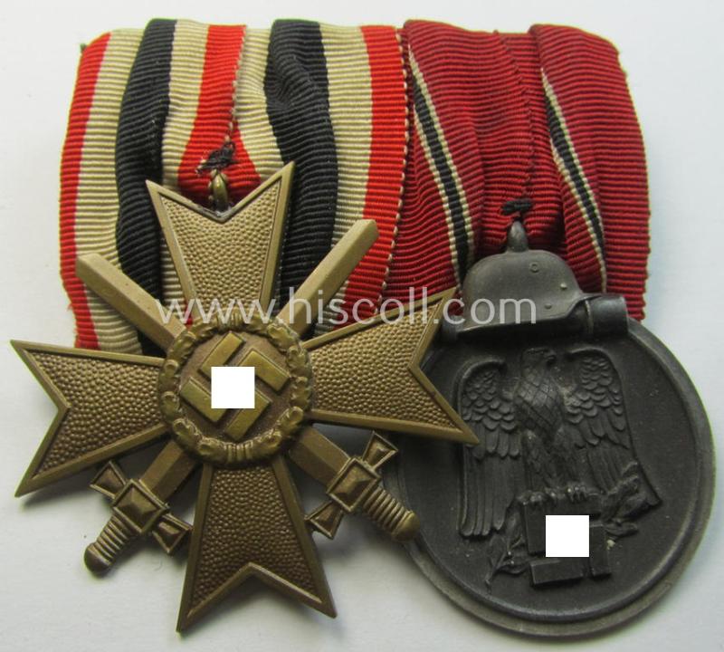 Attractive - and desirable! - two-pieced medal-bar (ie. 'Orden- o. Doppelspange') showing a: 'KvK II.Kl. mit Schwertern' and a: 'Medaille Winterschlacht im Osten 1941-42' that both come period-mounted as a: 'Doppelspange'