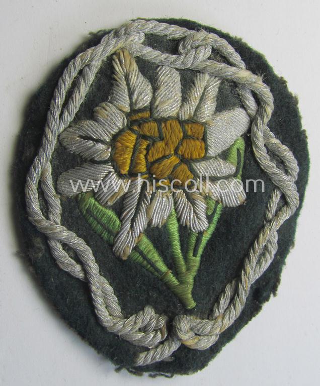 Superb - and scarcely found! - WH (Heeres) neatly hand-embroidered- and/or typical officers'- (ie. 'variant'-) pattern so-called: 'Edelweiss'-arm-badge (as specifically intended for usage by an officer serving within the 'Geb.-Jäger-Truppen'