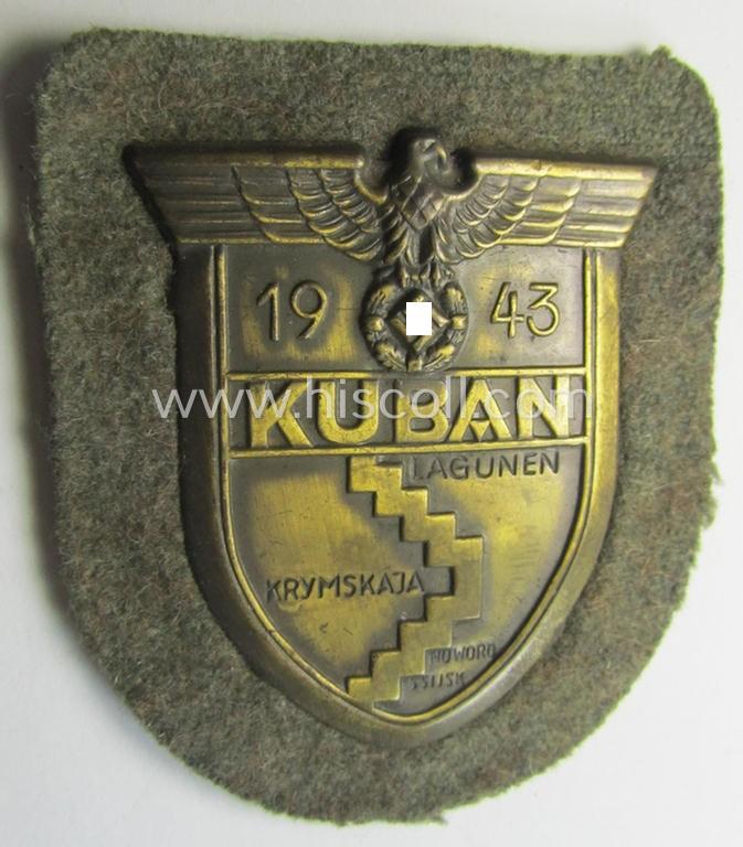 Stunning - and actually scarcely encountered! - WH (Heeres ie. Waffen-SS) 'Kuban'-campaign-shield that comes mounted onto its original field-grey-coloured- and/or woolen-based 'backing'