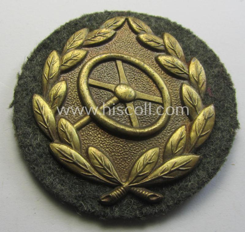 Superb, WH (Heeres- ie. Waffen-SS) so-called: 'Kraftfahrbewährungs-Abzeichen in Bronze' (or: bronze-class drivers' proficiency-badge) that comes mounted onto its piece of field-grey-coloured wool and that comes as issued- but never worn, condition