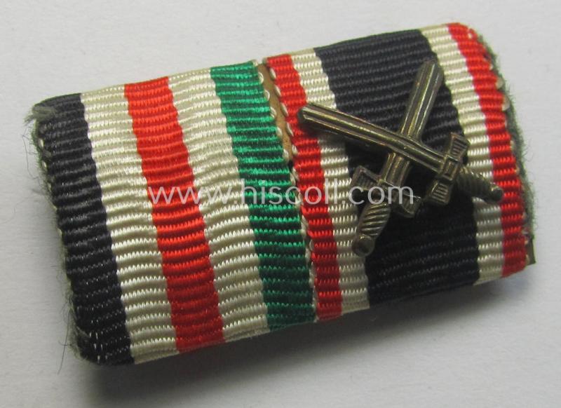 Two-pieced, WWII-period (ie. DAK-related!) medal-bar (ie. 'Band- o. Feldspange') showing resp. the ribbons for a: 'KvK II. Klasse mit Schwertern' and a: 'Deutsch-Italienische Feldzugsmedaille'