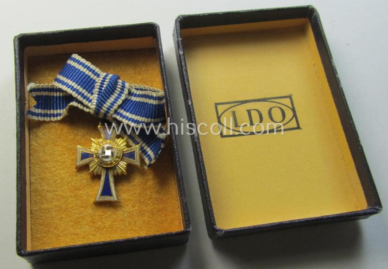 Miniature of an: 'Ehrenkreuz der deutschen Mutter - erste Stufe' (or: golden-class mothers'-cross) being a maker- (ie. 'L/58'-) marked example that comes stored in its (scarce!) period, generic-styled so-called: 2-pieced- and 'LDO'-marked box