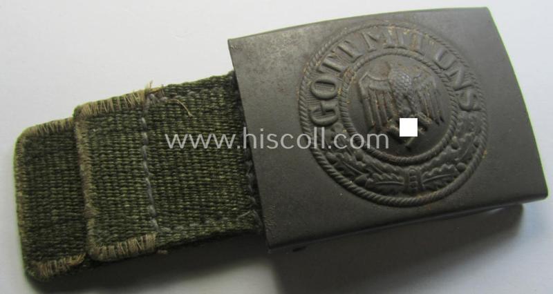 Superb - and hardly used! - WH (Heeres) 'tropical-issued' belt-buckle being a maker- (ie. 'HA 41'-) marked and/or typical olive-green-coloured example that comes mounted onto its original, greenish-coloured- (and/or: 'webbing'-based-) tab